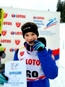 Tymoteusz Cienciała z medalem i dyplomem